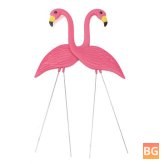 Pink flamingos with plastic ornaments - lawn ornaments