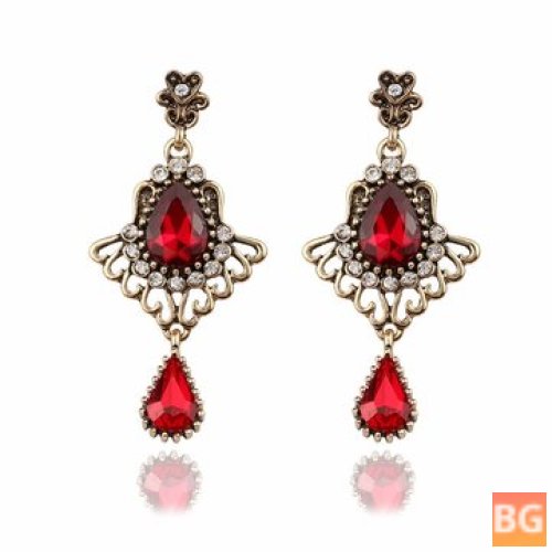 Ethnic Tassel Earrings with Drop-shaped Ruby Glass