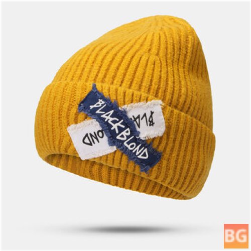 Women's Knitted Beanie Hat with a Raw Edge Patch