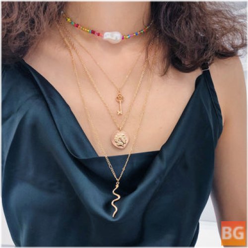 Multi- Layer Rice Beaded Pearl Necklace with Trendy Geometric Key