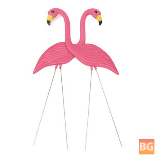 Pink flamingos with plastic ornaments - lawn ornaments