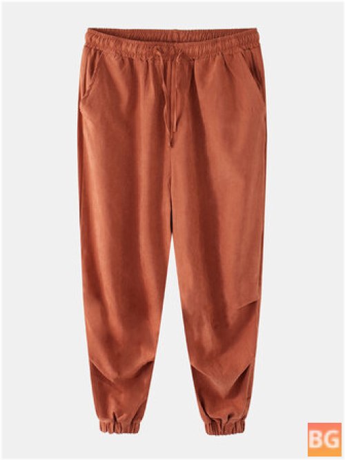 Pants with a Solid Color Pleat